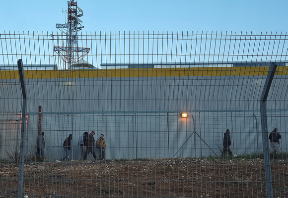 People crossing from Jerusalem into Palestinian controlled West Bank area of Bethlehem